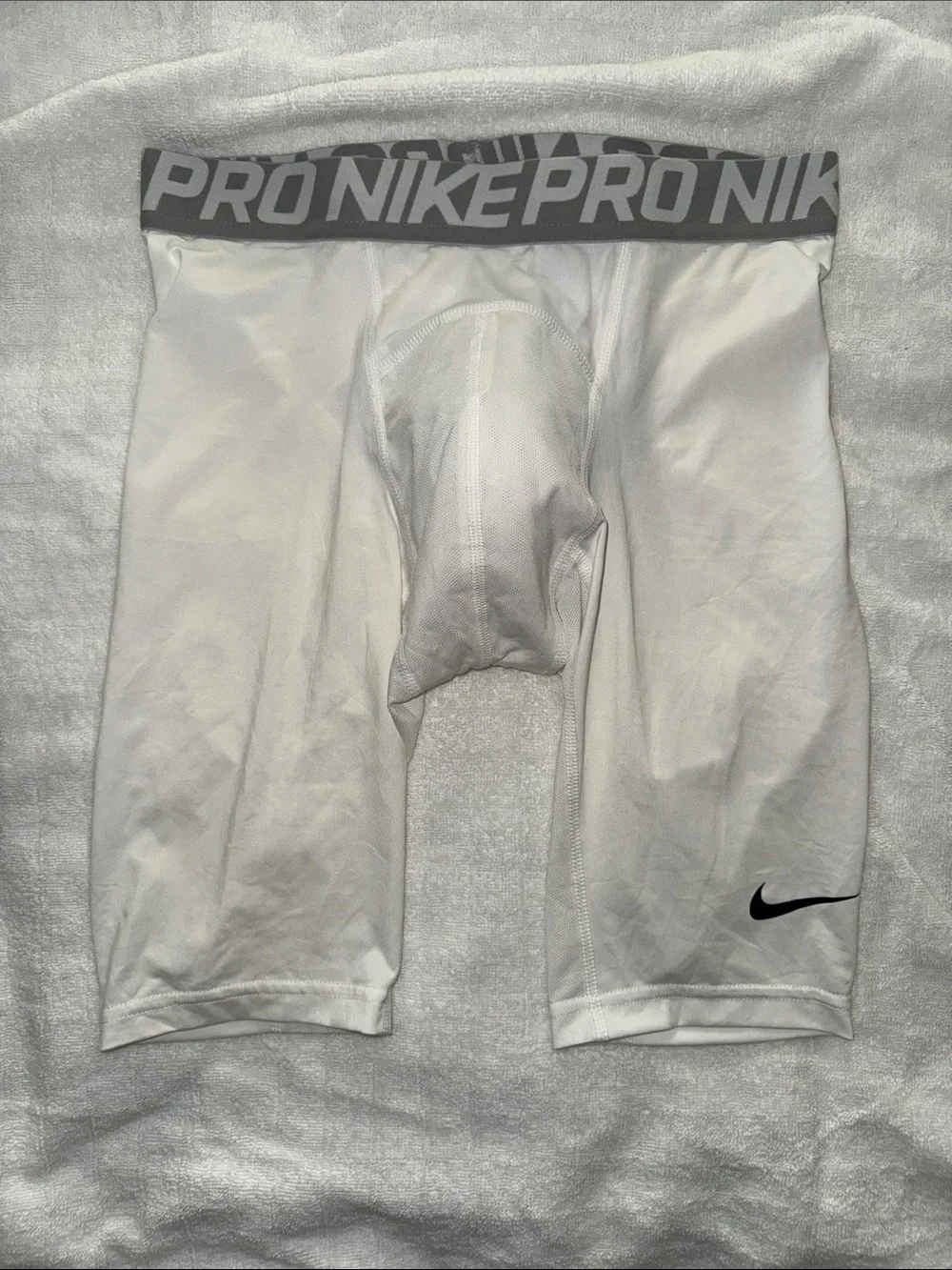 Nike White Pro Compression Shorts with Gray Waistband and Black Swoosh